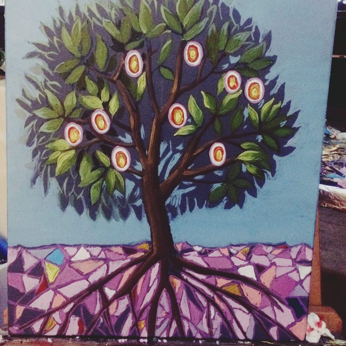 Tree with golden fruits over a mosaic ground